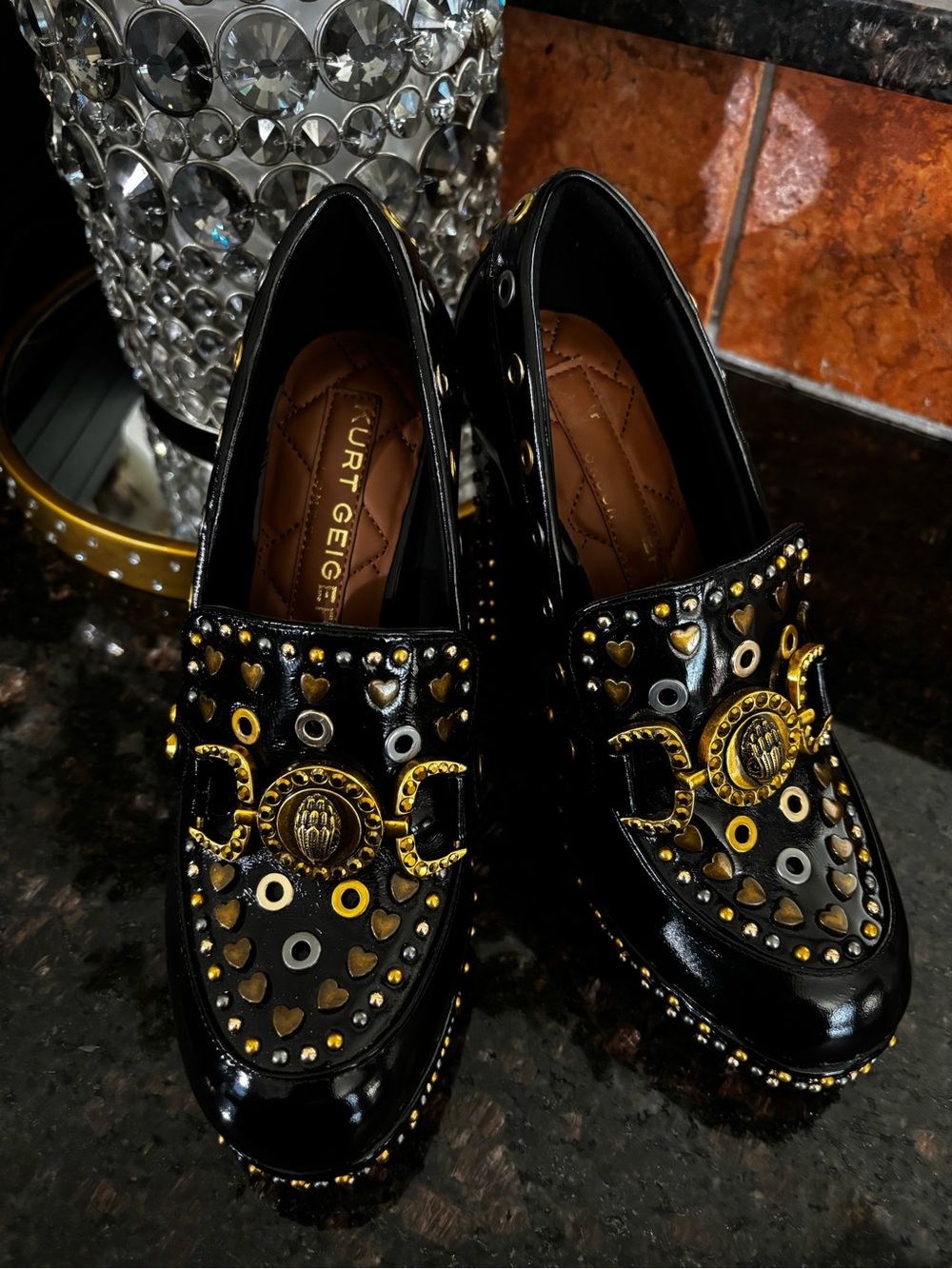 Kurt Geiger Black Patent Loafers with Gold Heart Stud & Grommet Detail